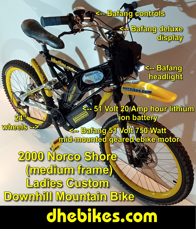 Custom made to order Womens electric downhill mountain bike by Pinnacle Innovations side view showing the Hope 2 piston downhill brakes, 24 inch wheelset and the Bafang 750 Watt mid mount electric motor kit and display with 20 Amp hour lithium ion 51 Volt battery.
