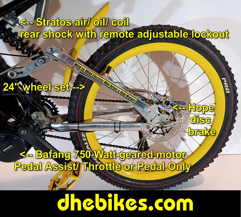 Custom made to order Womens electric downhill mountain bike by Pinnacle Innovations side view showing the Stratos rear air/ oil/coil shock with remote lockout and the 24 inch downhill mountain bike wheelset.
